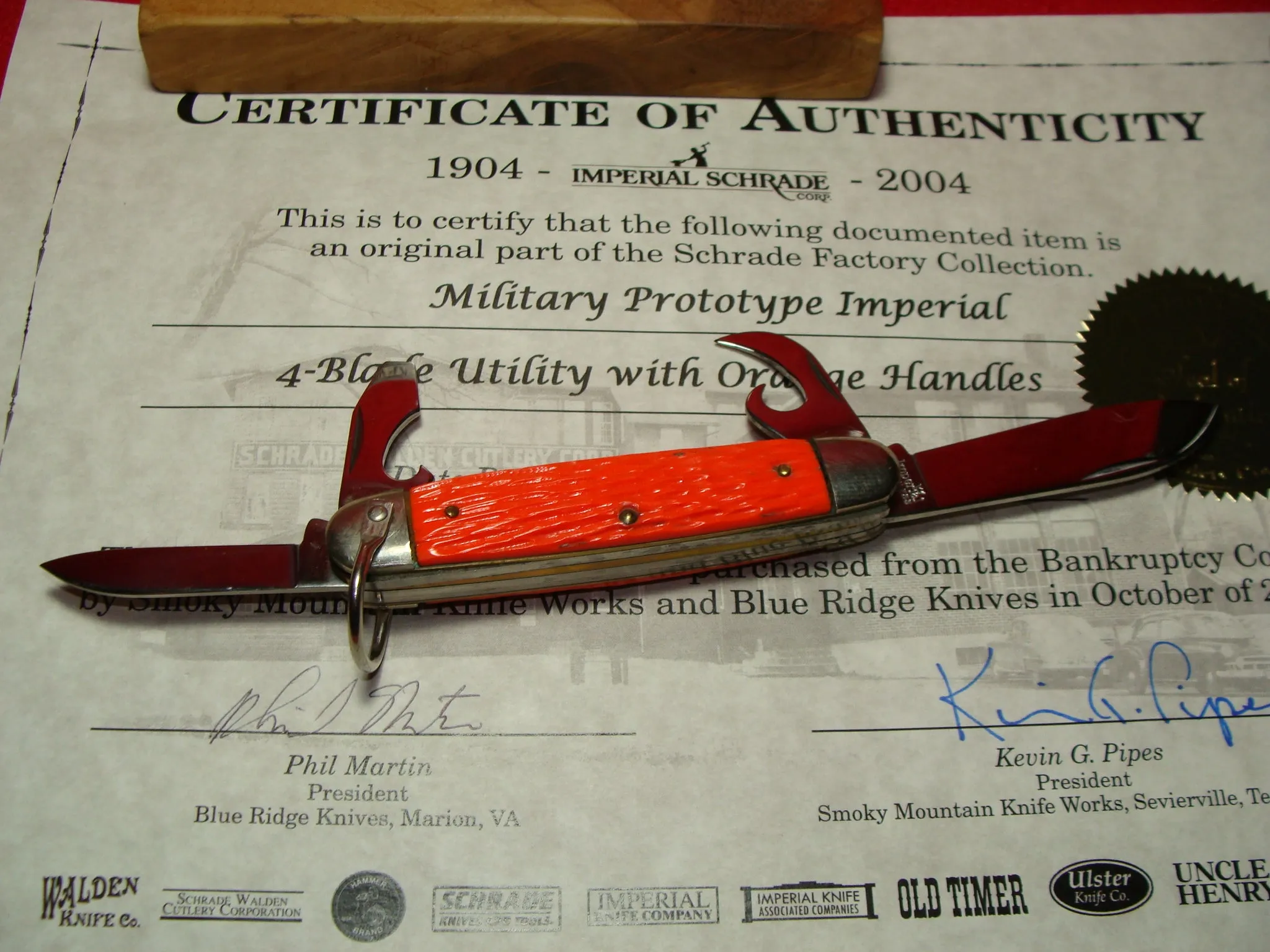 IMPERIAL STAINLESS USA 1960-76 MILITARY PROTOTYPE 4 BLADE UTILITY FOLDING NON AUTOMATIC KNIFE ORANGE DELRIN HANDLES PART OF THE SCHRADE FACTORY COLLECTION